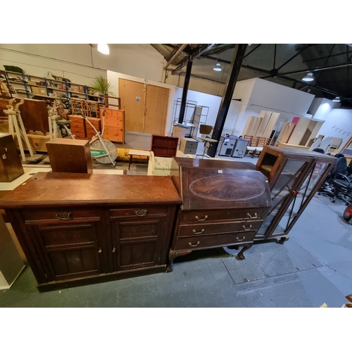 365 - An oak sideboard, an oak bureau and an oak framed glass display cabinet, etc