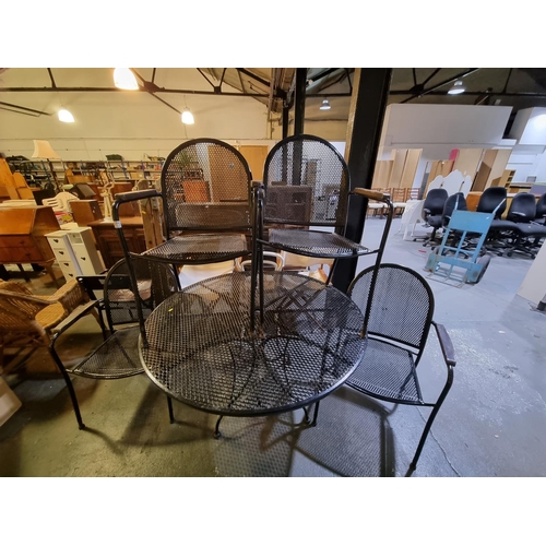 371 - A metal garden table and 4 chairs