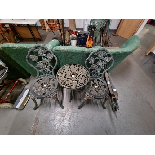 456 - Metal garden table and 2 chairs, bench ends and back piece etc