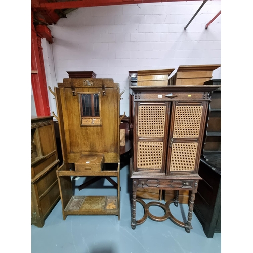 142 - An oak hallstand and a wicker fronted cabinet