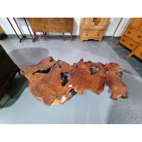 148 - A tree branch coffee table measuring 150cm in length and 37cm in height