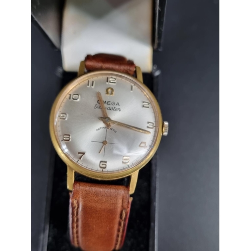 206 - A gold plated Omega Seamaster gents wristwatch with leather strap (appears to be working)