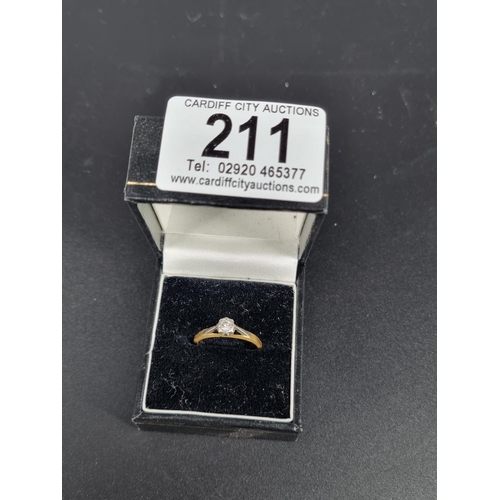 211 - An 18k gold and diamond solitaire engagement ring (base of the ring is very worn)