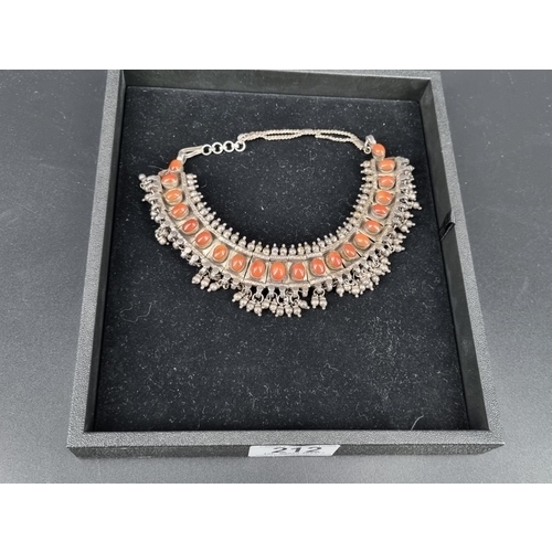 212 - A 1930s silver and amber (untested amber) choker necklace