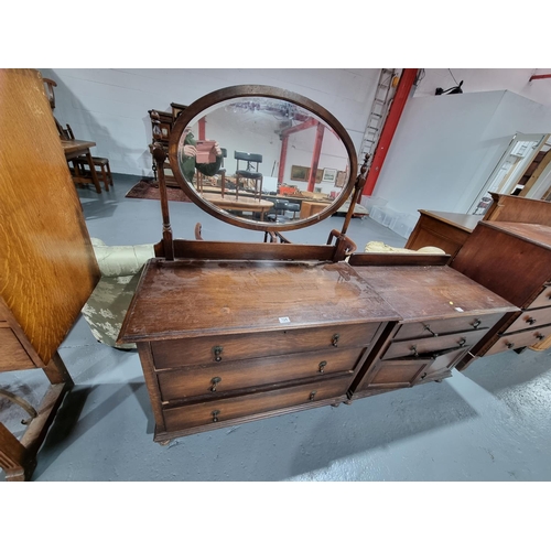 124 - An oak single mirror dressing table and matching two drawer two door cabinet