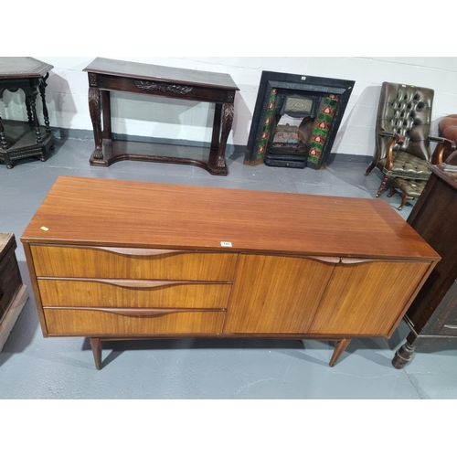 140 - A mid century teak sideboard designed by Elliots of Newbury for Royal Heritage