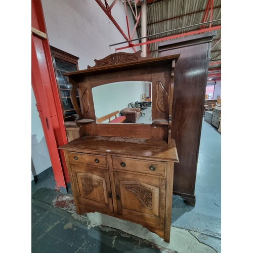 152 - An oak mirrored back dresser