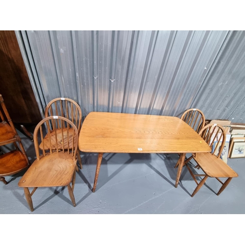 156 - An Ercol dining table with four chairs