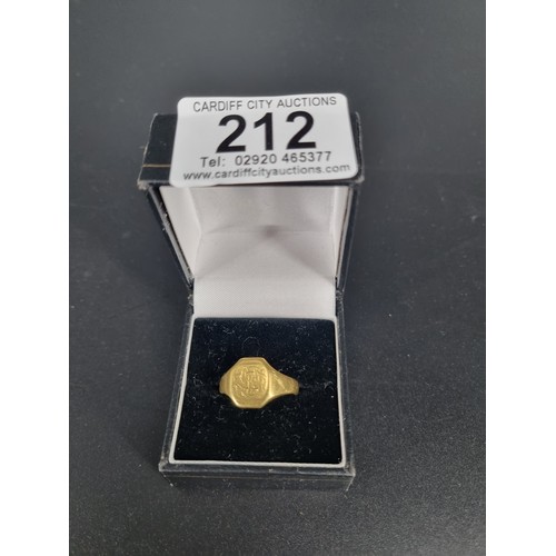 212 - An 18k gold signet ring (misshapen and inscribed) - weight 7.6 grams