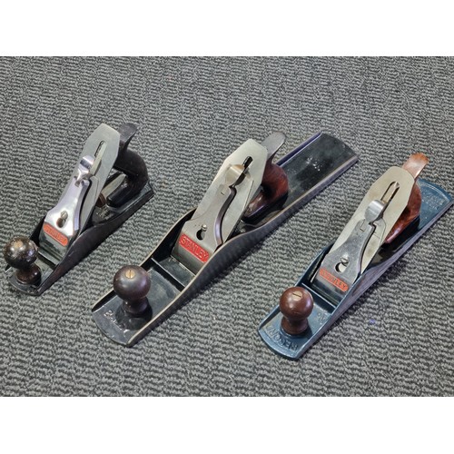 231 - A Stanley/Bailey No. 6 wood plane, a Record No. 5 plane and a Stanley/Bailey No. 4 plane