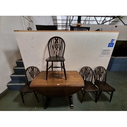 384 - Oak drop leaf table and 4 oak wheel back chairs