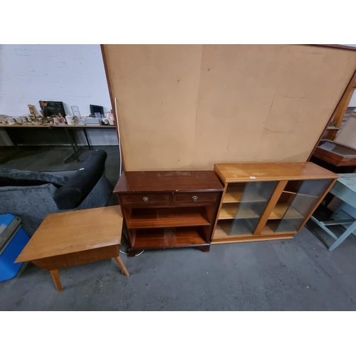 429 - Teak glass fronted bookcase, mahogany bookcase and a teak sewing box
