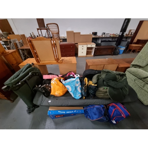 447 - Sporting items to include fishing beds, sleeping bags, in line roller skates, guitar etc