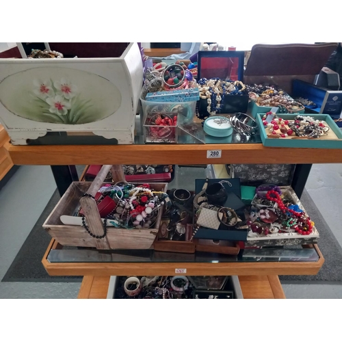 280 - Two shelves of costume jewellery