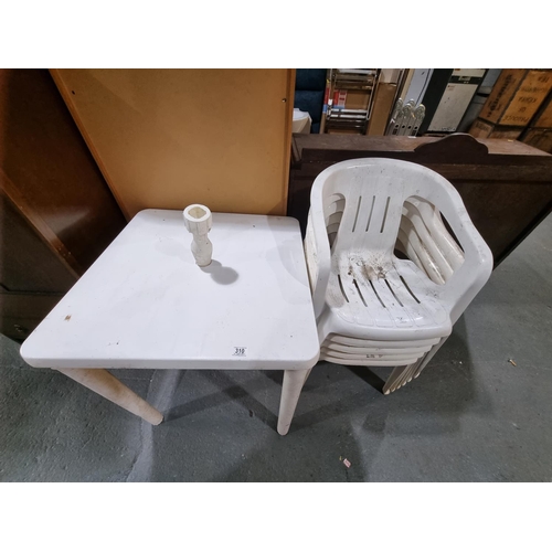 310 - White plastic patio table and 4 chairs