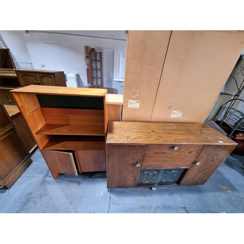 320 - An oak sideboad and a teak bookcase