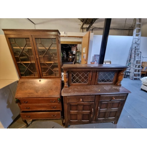 340 - An oak court cupboard and bookcase bureau