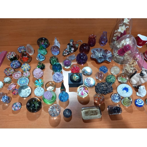 67 - A collection of paperweights and glassware