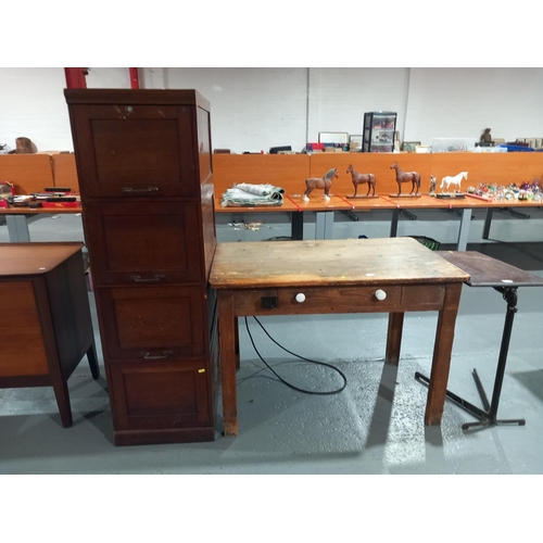 108 - A mahogany filing cabinet, pine kitchen table and a hospital table