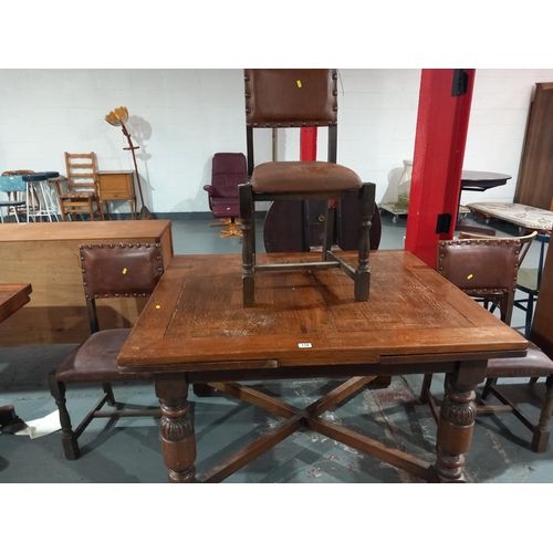 118 - An oak dining table and 3 chairs