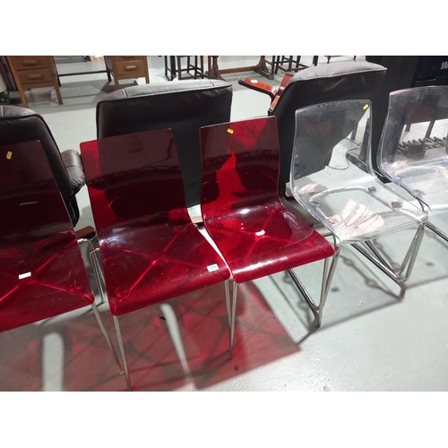 129 - Three red perspex chairs and two clear perspex chairs