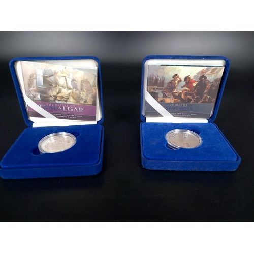 212 - Sterling Silver Nelson 5 pound coin and sterling silver Trafalgar 5 pound coin in presentation cases... 