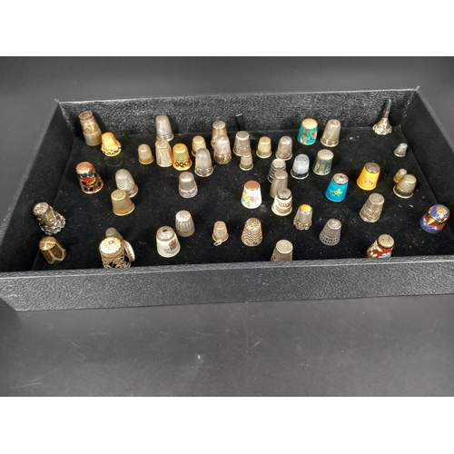 215 - A collection of metal and white metal thimbles - some with enamel decoration