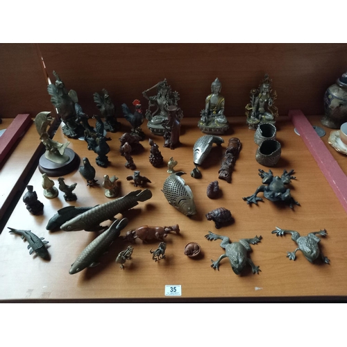 35 - A quantity of decorative metal and wooden figures