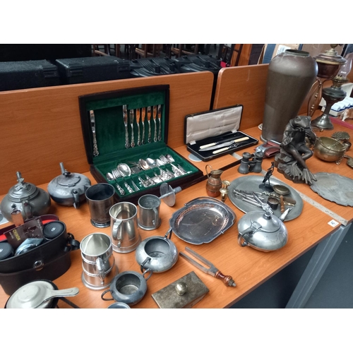 40 - A metalware lot - brass/copper, pewter etc including a brass and copper table lamp, oil lamp, a larg... 