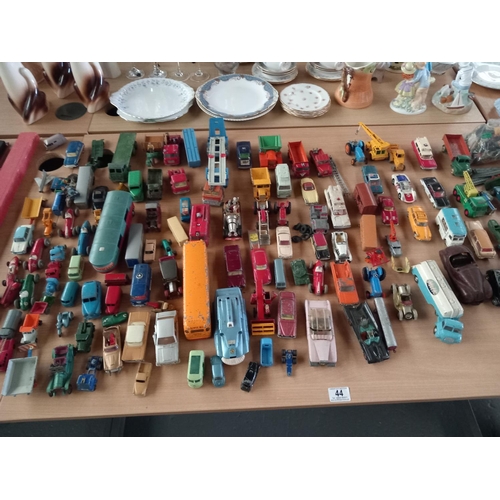 44 - A collection of playworn diecast model cars - to include early Dinky and Corgi