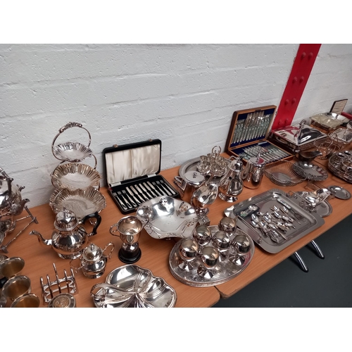 8 - A good collection of silver plated items including cutlery sets, tea sets, warmers, table ware etc