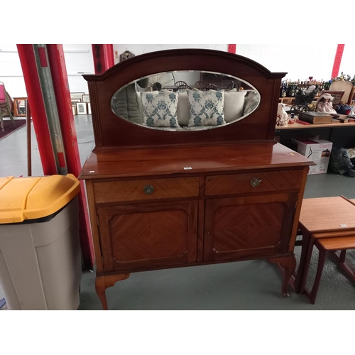 100 - A mahogany mirrored back sideboard