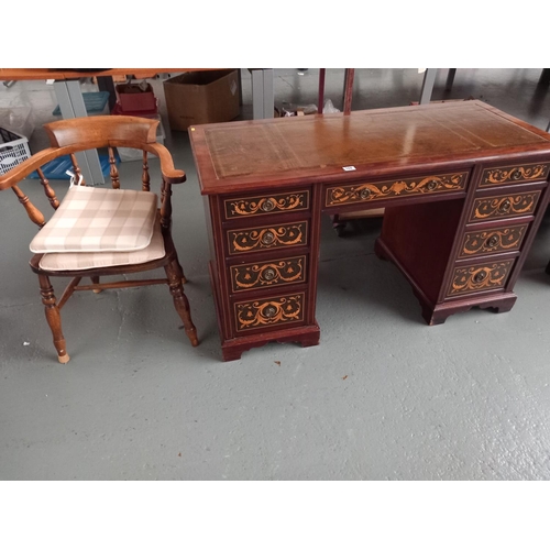 108 - A twin pedestal mahogany desk with leatherette insert and a oak captains chair