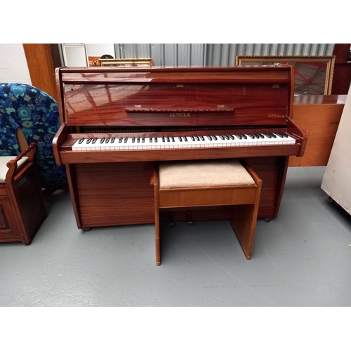 121 - A Zender supplied by Crane & Sons Ltd wrought iron frame upright piano together with a piano stool