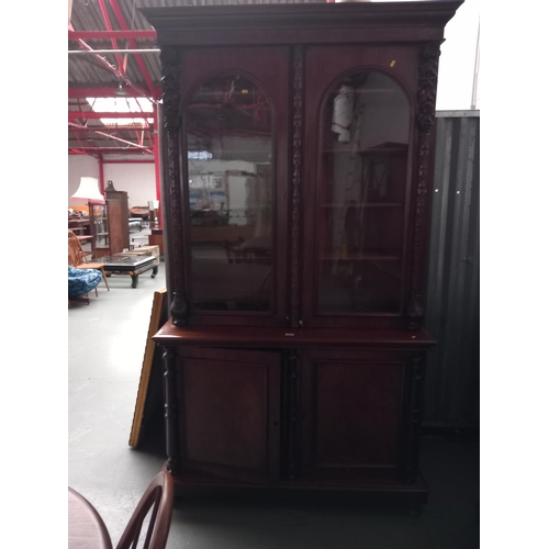 154 - A Victorian mahogany Chiffonier bookcase with carved decoration