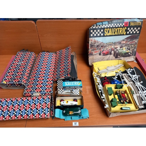 57 - A vintage scaletrix set including cars - a boxed auto union (1936) vintage racing car, a Jaguar D ty... 