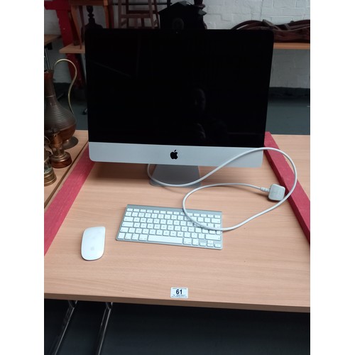 61 - An apple Mac computer with keyboard and mouse (untested) powers up with full screen (passwords etc u... 