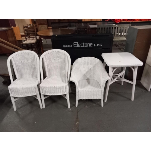 339 - 3 white wicker chairs and a white wicker table