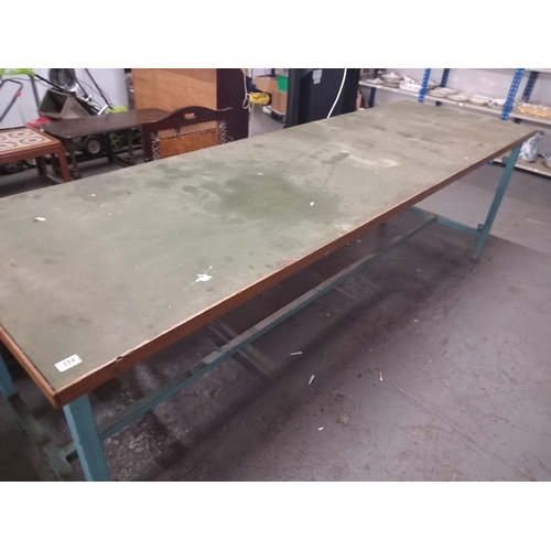 354 - A wooden workshop table on metal frame