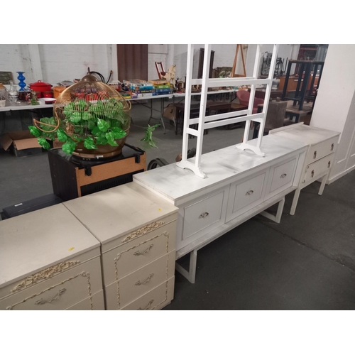 372 - A white modern sideboard, 2 x bedside tables and a chest of drawers, etc