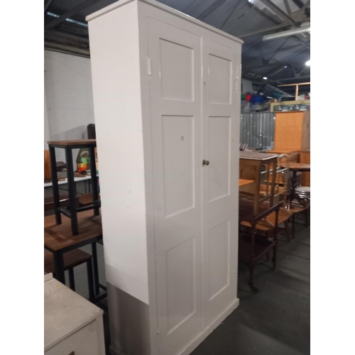 373 - A painted double wardrobe