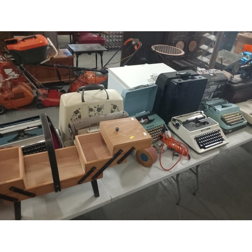 393 - Mixed items to include typewrites, sewing machines, slide projectors, etc