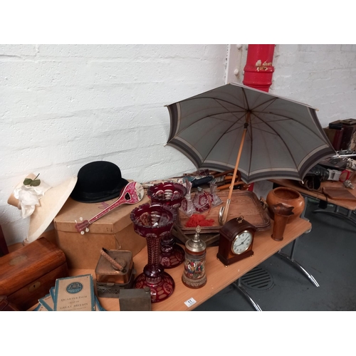 11 - A vintage lot to include a tea caddy, an Elliot 8 day mantle clock with chimes, bowler hat, glasswar... 