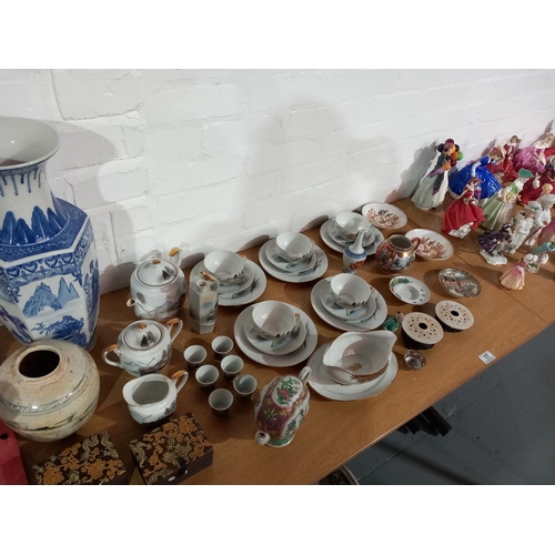 17 - A large collection of figurines (mostly Royal Doulton) together with some oriental china