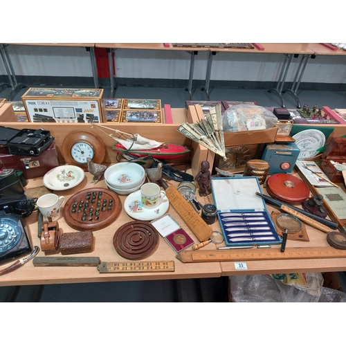 33 - A vintage lot including miniature signed cricket bats, telephone, cigarette cards, wooden rules etc