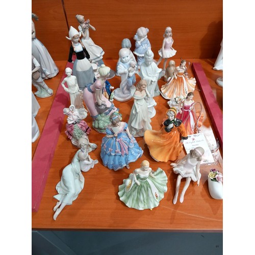 75 - A large collection of Nao and Lladro figurines - approximately 45 in total and other figurines