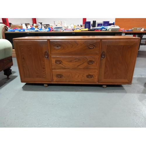 101 - An Ercol sideboard on casters