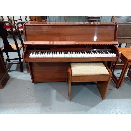 124 - A Zender supplied by Crane & Sons Ltd wrought iron frame upright piano together with a piano stool