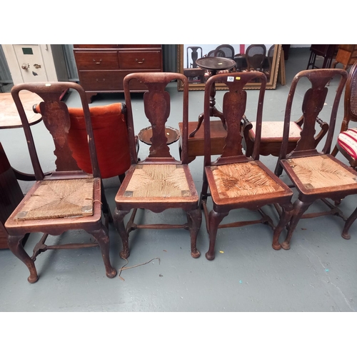 135 - Four inlaid rush seated dining chairs