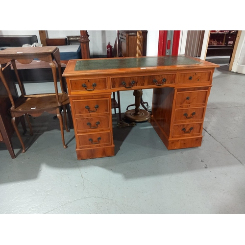 130 - A twin pedestal desk with leatherette insert